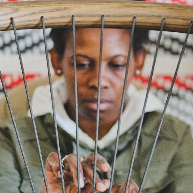 The finishing touch — each woven seat completed by the same hands, start to finish.